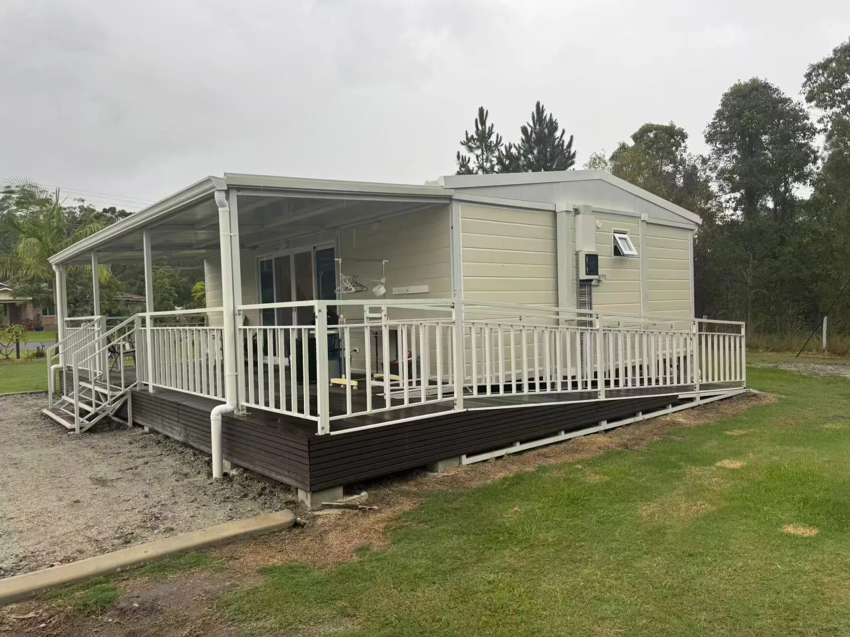 Expandable container house with customized covered veranda